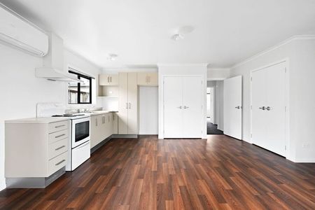 This well-maintained two-bedroom, one-bathroom home offers a practical and inviting living space in a highly sought-after location. - Photo 5