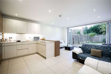 A contemporary four bedroom townhouse with a driveway. - Photo 2