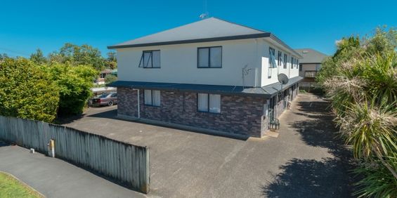 This furnished studio unit includes an ensuite bathroom and a small kitchenette. - Photo 3