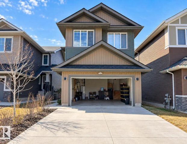 #Main floor 1565 ESAIW PL NW — 3 Bedroom - Photo 1