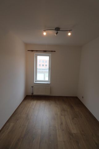 Een gerenoveerd appartement op de eerste verdieping achteraan met autostaanplaats - Foto 4