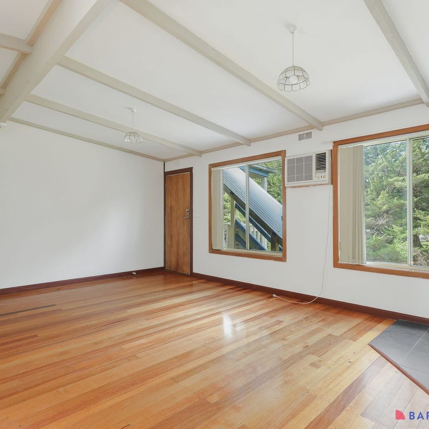 Refined Coastal Living in a Spacious Dual-Level Residence - Photo 1