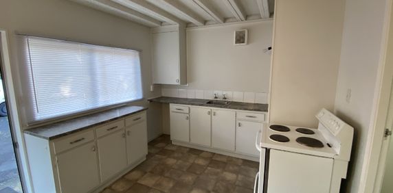 This tidy downstairs unit offers one living area, one bedroom and a bathroom with the laundry included. - Photo 2