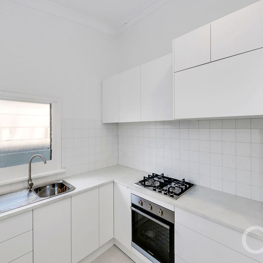 Open the Door to Coastal Charm with Modern Comfort - Photo 1