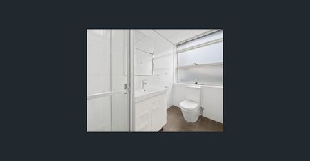 ****Renovated 2 Bedroom Apartment**** NOTE: the mural of the beach is actually affixed to the back wall of the property and not photo shopped - Photo 3