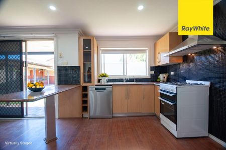 COMFORTABLE & UPDATED THREE BEDROOM FAMILY HOME LOCATED IN A QUIET STREET - Photo 4