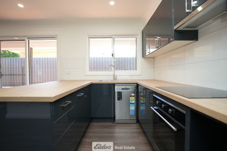 Convenient 2-Bedroom Unit with Low Maintenance - Photo 2