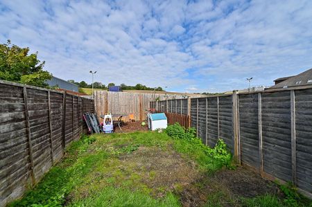 A spacious three bedroom home with allocated parking for two cars. - Photo 3