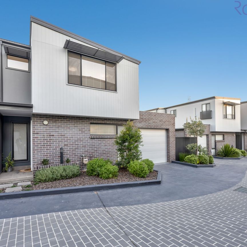 Modern three bedroom, two bathroom townhouse with air-conditioned living space. - Photo 1