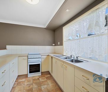 Charming Lowset Home with Private Yard and Modern Comforts - Photo 6