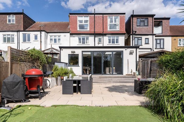 A beautifully presented and substantially extended five-bedroom family home, ideally positioned in SW19 and offered to the market on an unfurnished basis. - Photo 1