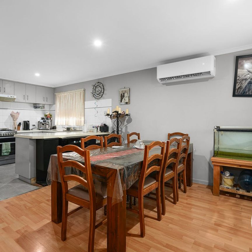 PRACTICAL THREE-BEDROOM BRICK HOME WITH REAR ACCESS - Photo 1