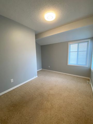 Charming 3-Bedroom Home with Extra Storage & Outdoor Parking - Photo 3