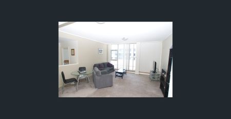 Modern one-bedroom apartment with balcony and water views - Photo 3