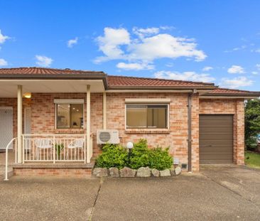Front 2 Bedroom Villa with Lock up Garage - Photo 1