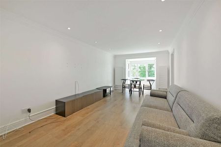 A bright and modern two bedroom first floor apartment with resident parking. - Photo 2