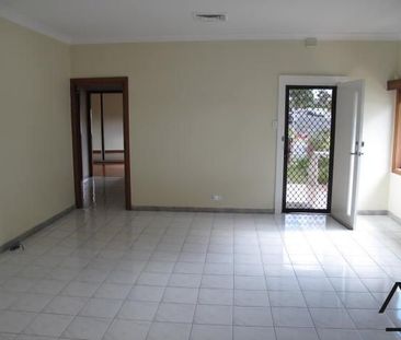 Spacious Brick Family Home with Generous Living in Greenacre - Photo 1