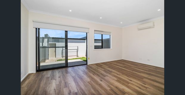 **RECEIVE ONE MONTH FREE RENT, ASK US HOW!!! Spacious 4-Bedroom Townhome for Lease in Cloverton Estate - Photo 1