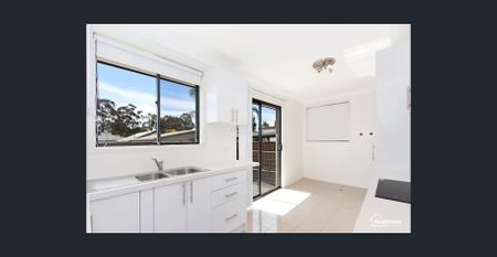 Charming Family Home with Spacious Yard in Prime Quakers Hill Location - Photo 4