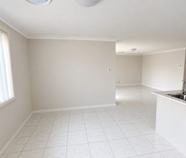Brand New Home with Ducted A/C - Photo 1