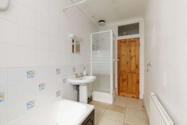Attractive period conversion property with charm and character located on a popular, tree-lined street. - Photo 1