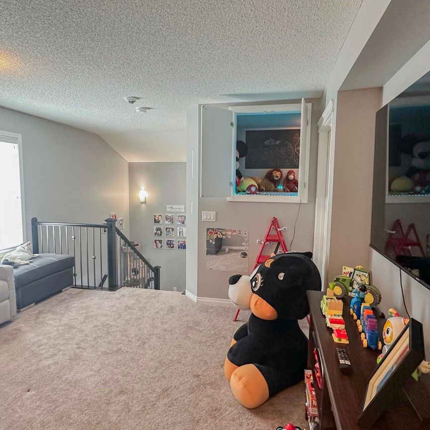 Stylish Auburn Bay Duplex With Garage & Newly Finished Basement - Photo 1