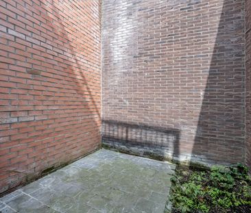 Lichtrijk gelijkvloers appartement met terras op toplocatie! - Foto 1
