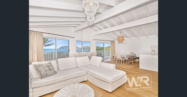 ESCAPE THE ORDINARY AND ENJOY BEACH-FRONT LIVING AT ITS FINEST - Photo 1