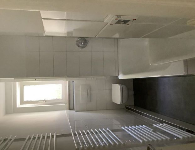 Etwas besonderes: praktische 2-Zimmer-Wohnung mit Fußbodenheizung im Bad - Foto 1