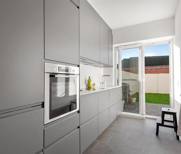 Gelijkvloers appartement met terras en tuin. - Foto 2