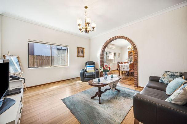 Spacious Full-Brick Home with Large Garage and Prime Punchbowl Location - Photo 1