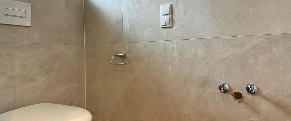 Erstbezug: Moderne Bungalowhälfte mit Einbauküche & Carport in ruhiger Siedlungslage von Wiesmoor - Foto 1