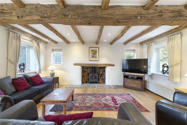 Offered in immaculate condition with space and character in abundance, an outstanding 5 bedroom barn conversion on a half acre plot in the heart of the beautiful village of Gomshall - Photo 1
