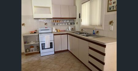 Charming 2-Bedroom Home with Sunroom and Lovely Gardens - Photo 2