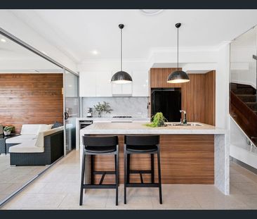 Stylish 3-Bedroom Townhome with Entertainer’s Deck & Modern Kitchen - Photo 6