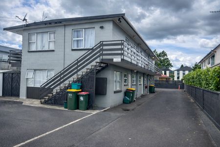Tidy and spacious, this one-bedroom upstairs flat sits in a quiet block of six and is just a short walk from Waikato University — making day-to-day living super convenient. - Photo 5