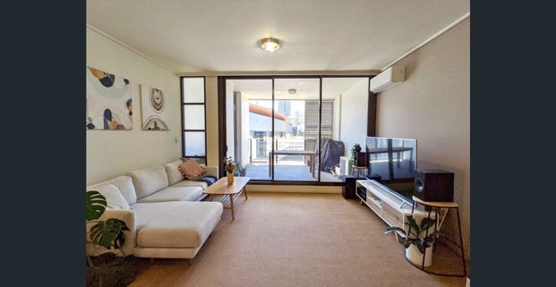 FABULOUS ONE BEDROOM + STUDY APARTMENT WITH CITY VIEWS + LARGE ENTERTAINING BALCONY - Photo 1