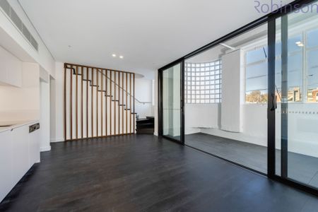 Modern split-level apartment with luxe finishes in a prime location. - Photo 2