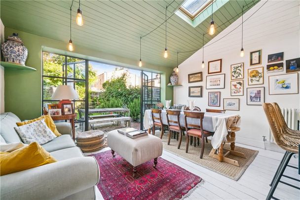 Delightful three-bedroom Victorian terraced house, beautifully presented throughout with a large extended kitchen and dining room leading on to a pretty private garden. Close to Tooting Broadway tube (Northern Line), St Georges Hospital and great schools. - Photo 1