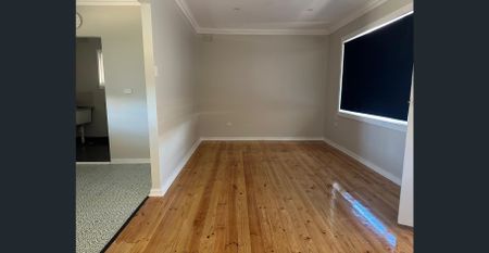 Family Home with Modern Comforts and Spacious Backyard - Photo 2