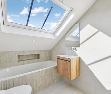 An elegant period home arranged over three floors, blending timeless character with generous living space and a private rear garden. - Photo 4