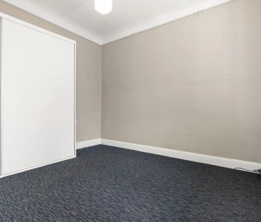 Character filled home on a level sunny block - Photo 1