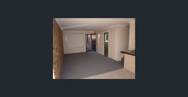 Neat & Comfortable Unit in a Prime Location! - Photo 1