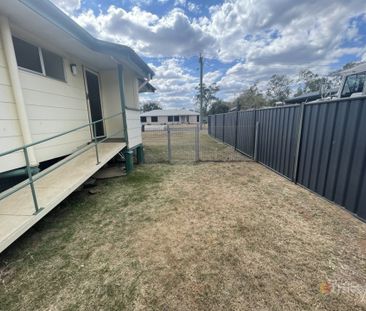 Comfortable Three-Bedroom Home with a Fully Fenced Yard - Photo 1