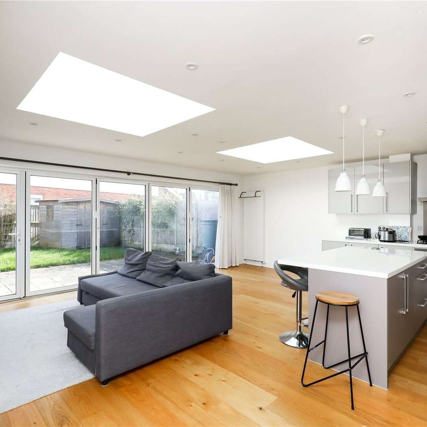 A modern four bedroom family home benefitting from off-street parking. - Photo 1