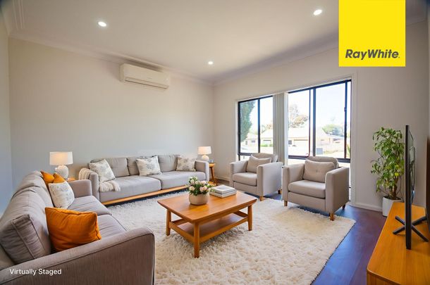 COMFORTABLE & UPDATED THREE BEDROOM FAMILY HOME LOCATED IN A QUIET STREET - Photo 1