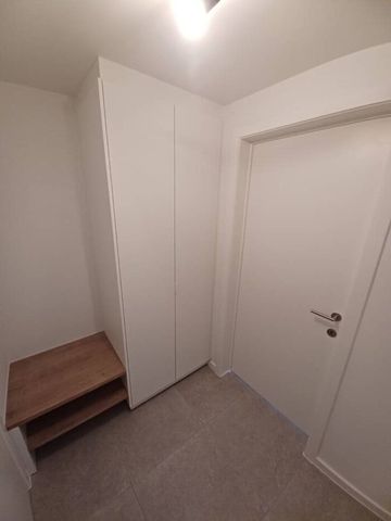 BEN- APPARTEMENT MET 2 KAMERS, GROOT TERRAS EN GARAGE VLAKBIJ DE MARKT TE GAVERE - Photo 5