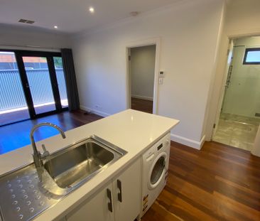Open the Door To Effortless Coastal Living in a Stylishly Renovated... - Photo 3