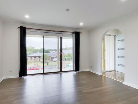 Renovated 3-Bedroom Home with Double Garage & Multiple Living Areas - Photo 3