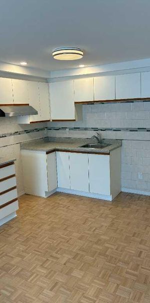 3 ½ en rez-de-jardin dans un Quadplex– Brossard Secteur N – Près du REM et DIX30 - Photo 1